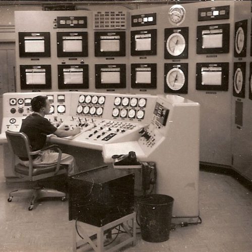 man sitting at control center desk