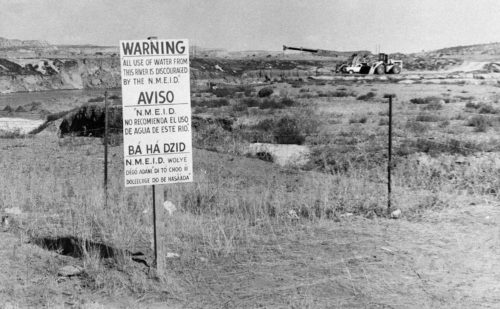water warning sign at uranium site in Rio Puerco