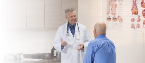 Doctor speaking with patient in doctors office