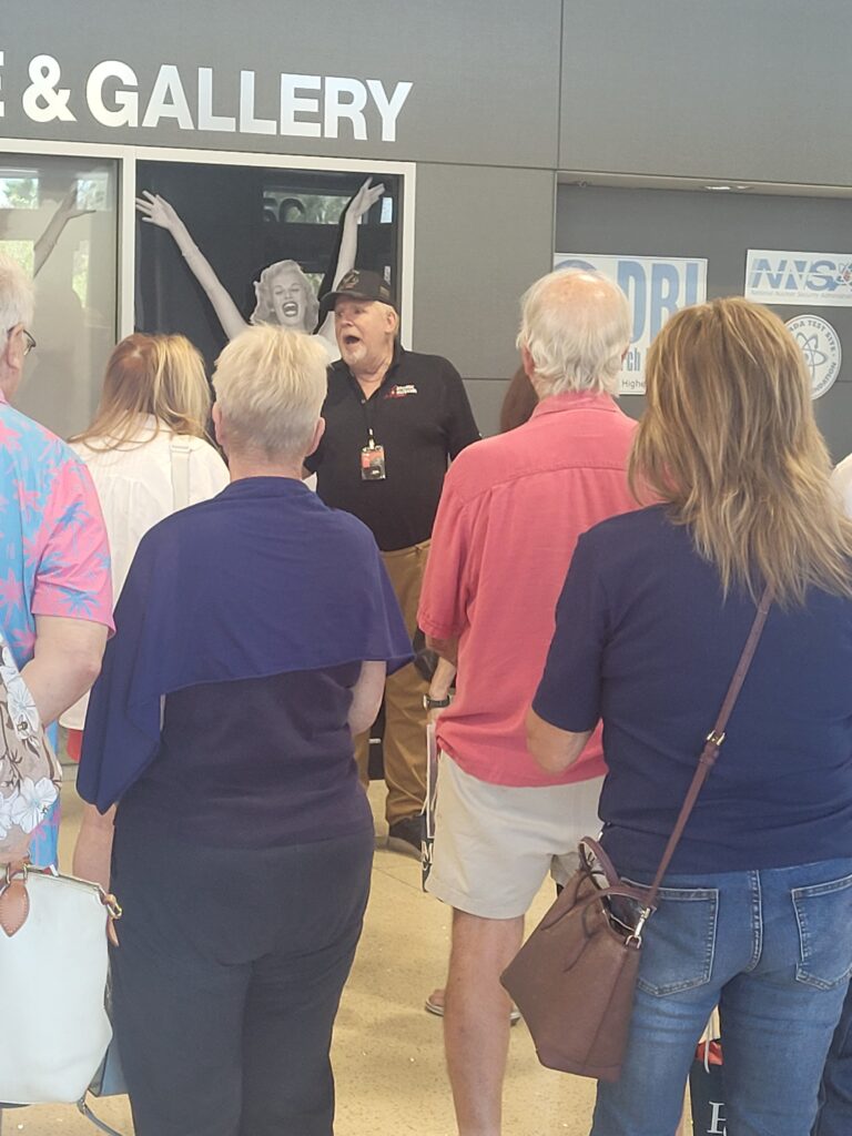 museum guide talking to patrons