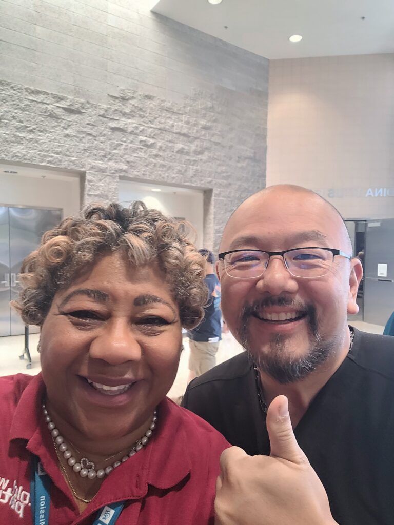 Cold War Patriots representative Twanna and a member displaying a thumbs up
