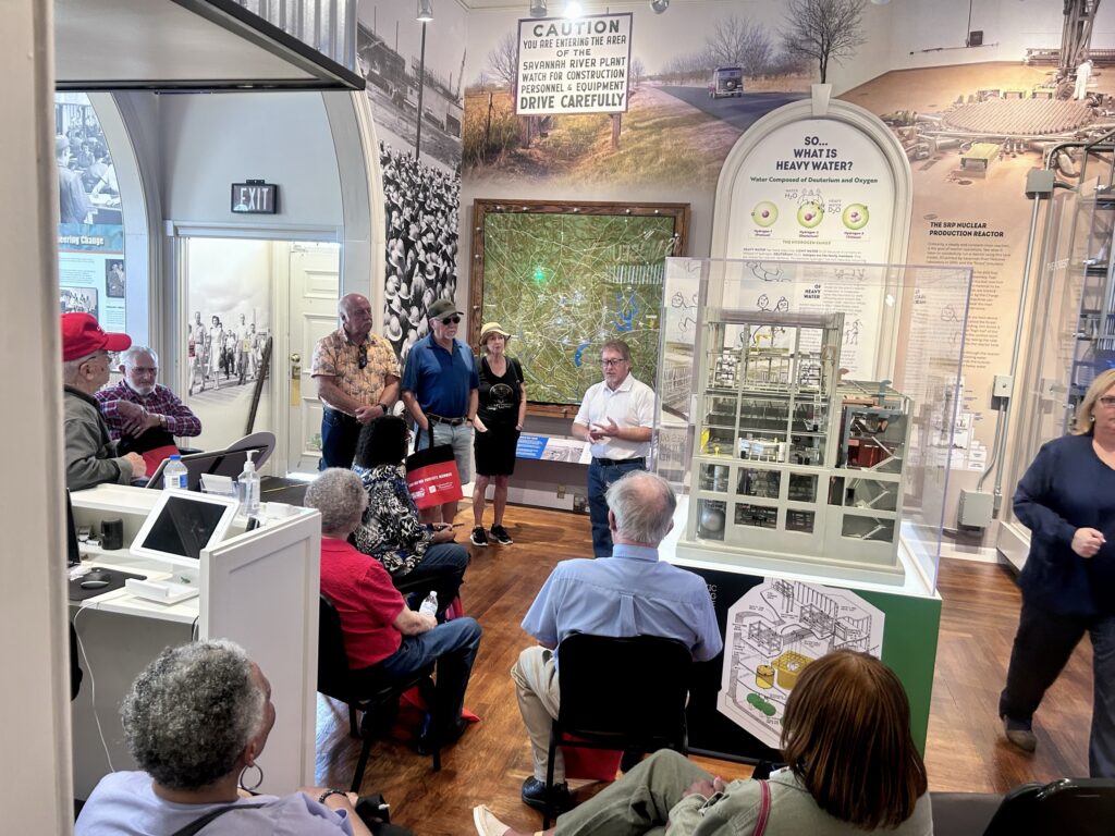 guests listening to a museum tour guide