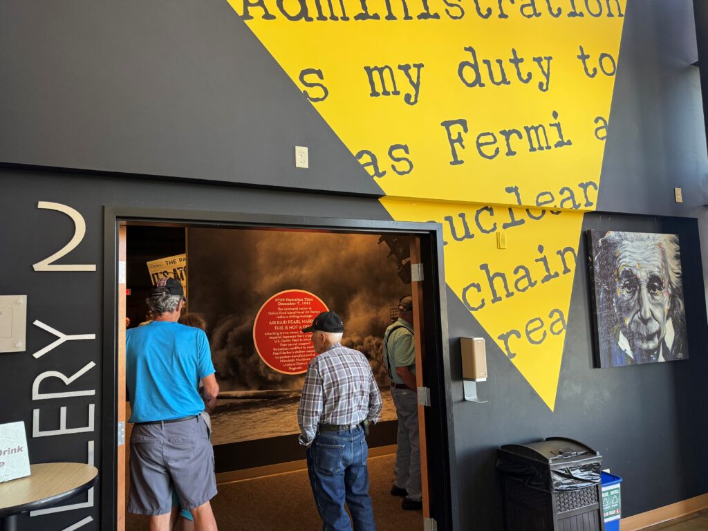 Two older men looking at a museum exhibit