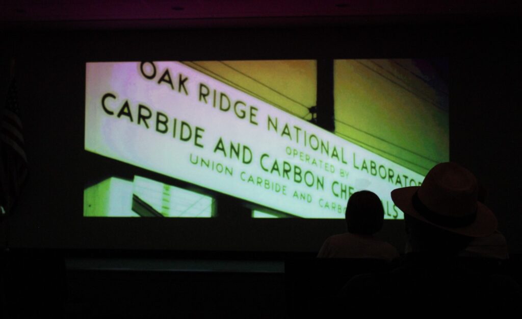 photo of movie playing with words "Oak Ridge National Laboratory" on the screen