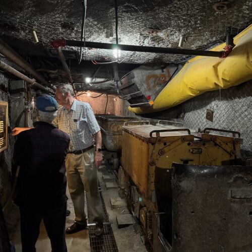 Man reviewing exhibit information at the New Mexico science museum.